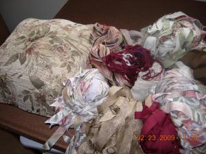 Fabric strips cut & ready to weave. Fabric in same colors as pillow.